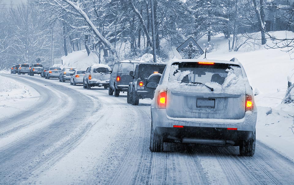 Care driving behind other cars in the winter.