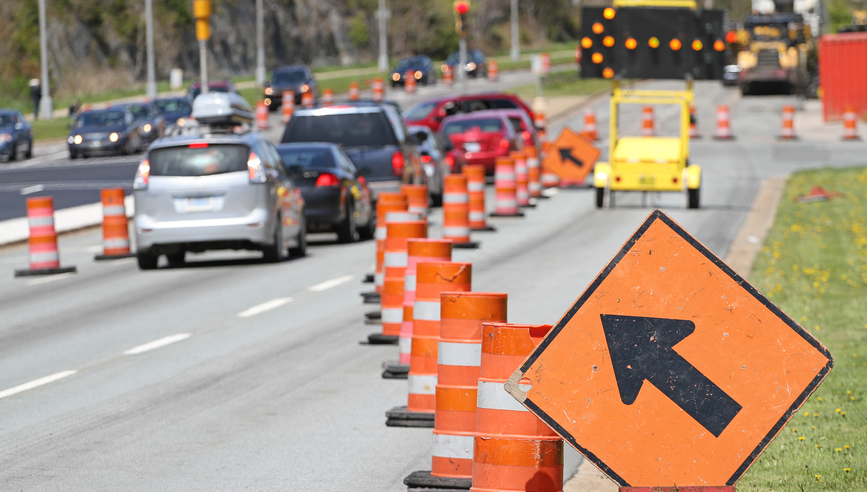 A sign on the road and traffic jam in the background.jpg
